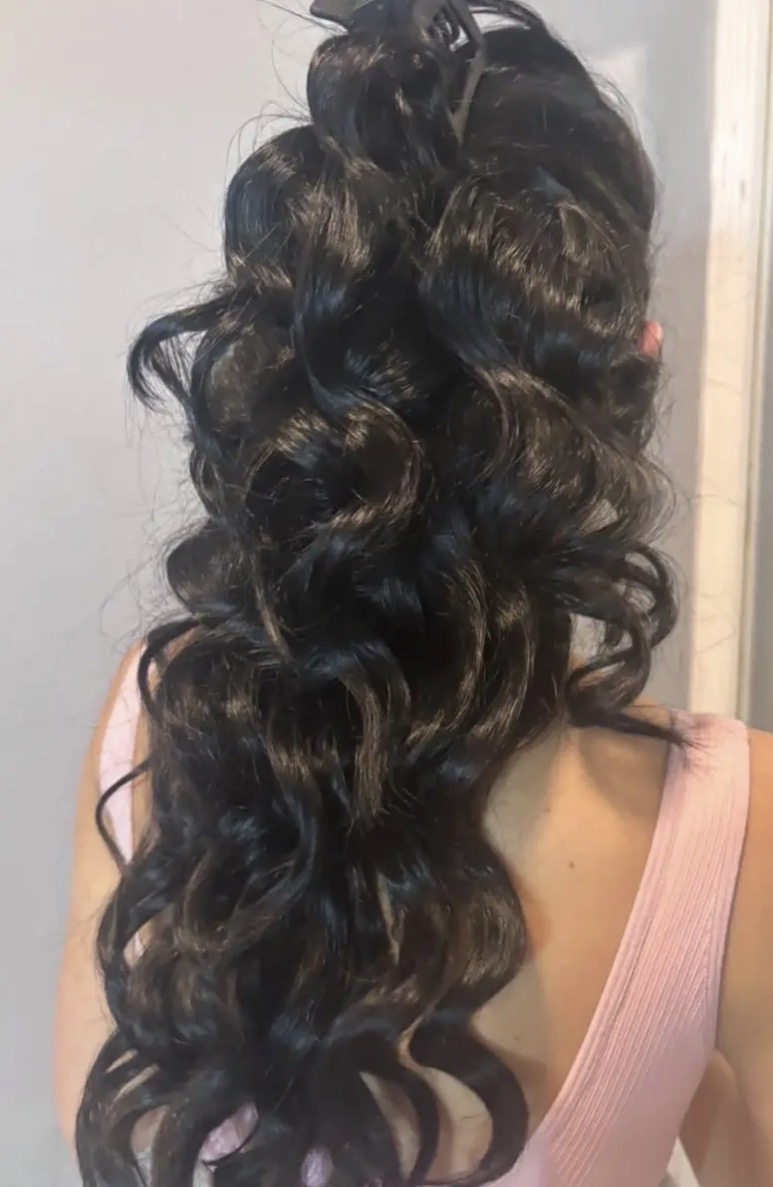 Curly half-up hairstyle created in our salon